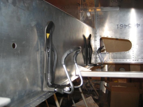 Water bottle holders riveted to spar tunnel (will be under pilot/pass knees)