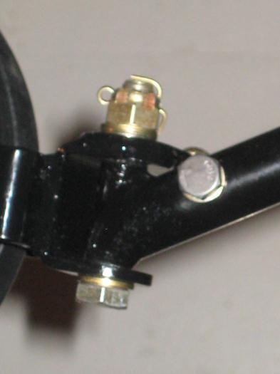 (Right) = spring rod secured with thru bolt. (Left) = pivot bolt secured