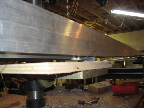 The root rib attach angle on the drill press, with some shims under for leveling