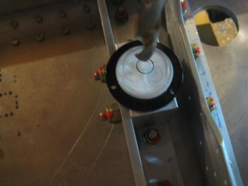 I used both a bullseye level (shown here) and a small straight level to check everything.