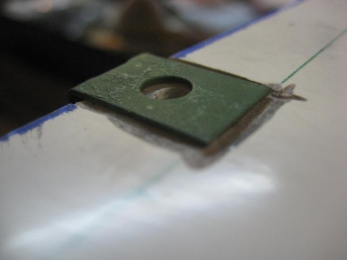 Tinnerman nut recessed into fiberglass (even if it doesn't look lik it)