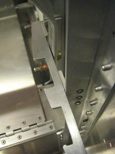 Flap detent angle - 3 attachment rivets seen on vertical support angle