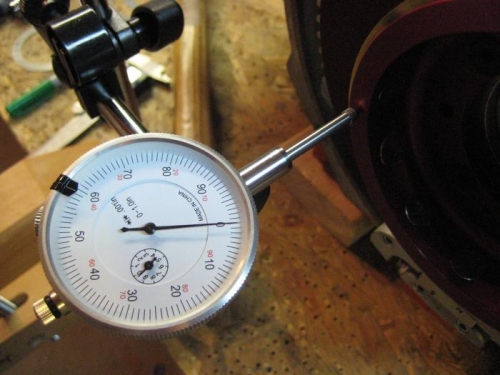 With crank/flywheel all the way forward, the micrometer reads 0.