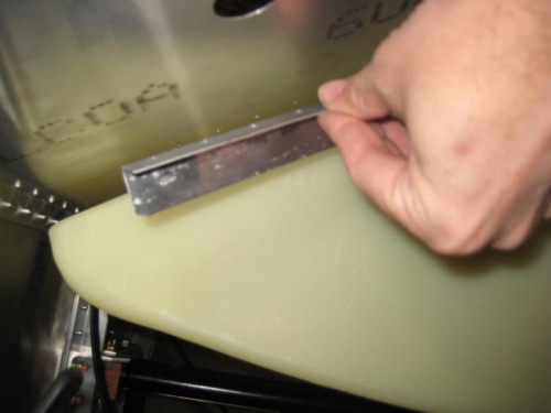 Removed the two fuel tank stops from under the glare shield.