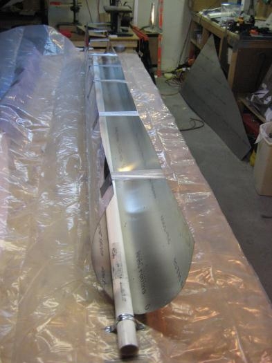 PVC pipe clamped over plastic, and the edges being drawn up.