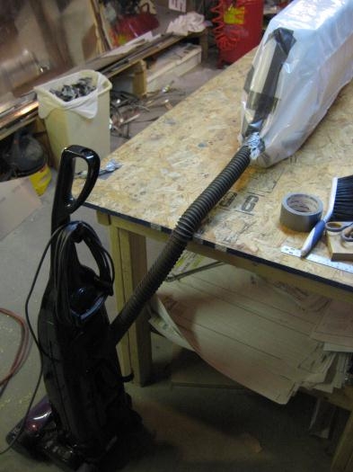 Home vacuum cleaner inside of taped bagging.