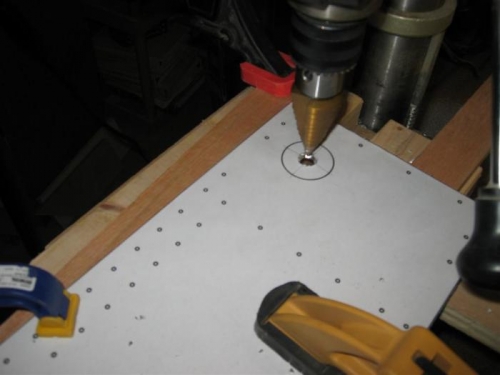 Drilling the large hole at the root end.