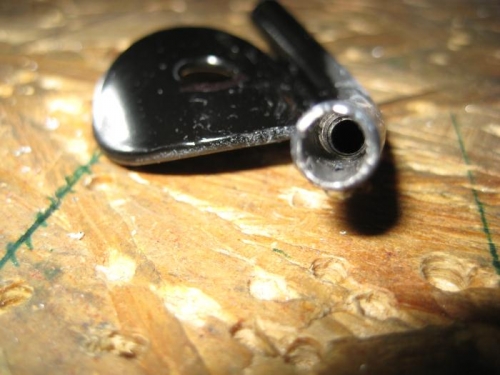 View down the end of one cable guide, with the enlarged hole drilled.