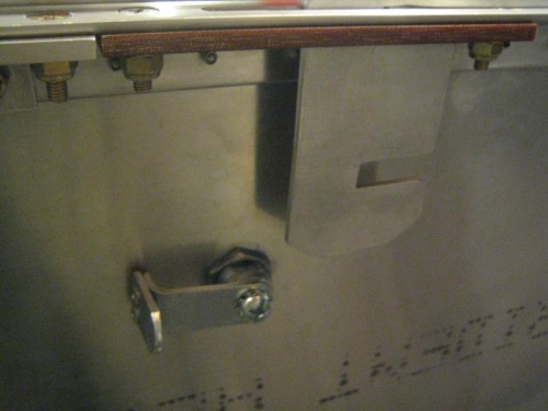 In the UNLOCKED position. The canopy latch will slide backward and clear the lock cylinder.