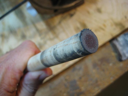 Emery cloth glued to end of wood dowel