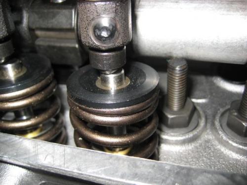 Head stud contacting the rocker assembly.