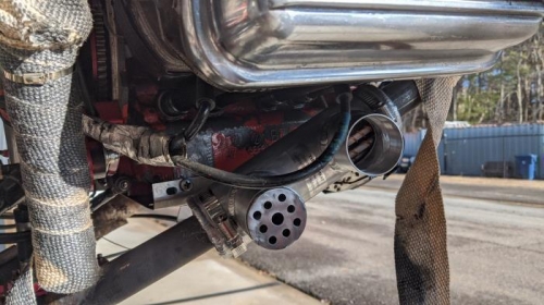 This version is closer to the exhaust port