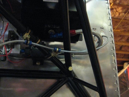 Throttle and mixture cables loosely  clamped in place.