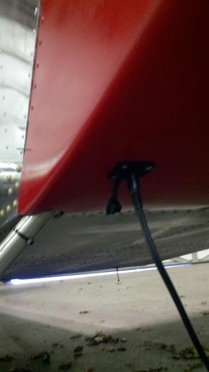 Battery charger plugged into port.