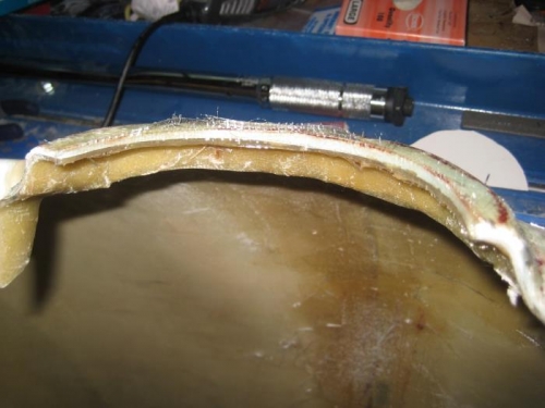 Some glass on the interior edge of the prop hub extension of the cowl.