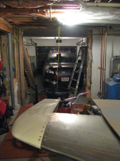 Now the view from inside the basement, looking out the removed wall, and into the garage.