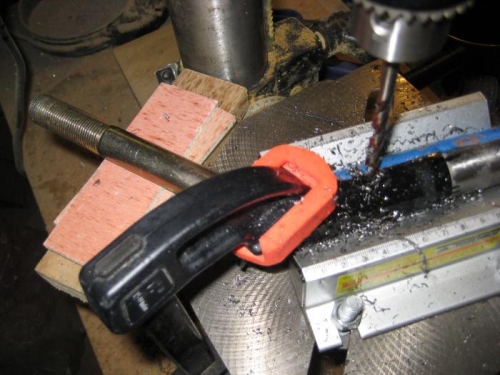 Drilling through the axle tube and the gear leg at the same time