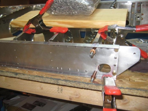 Rear spar (upside down) and ribs held flush on work table