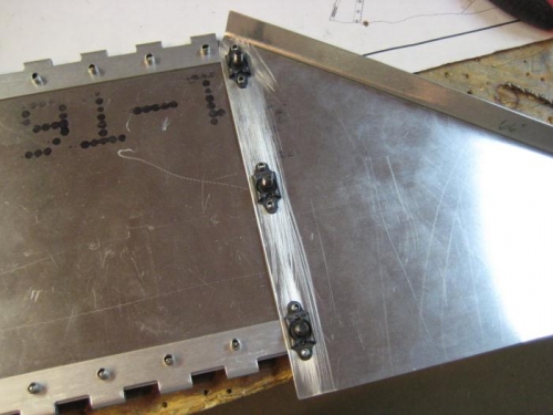 Floating 8-32 nut plates on the back of the fixed ends