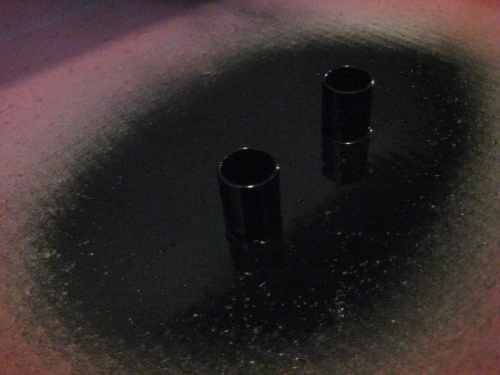 Axle spacers being painted.