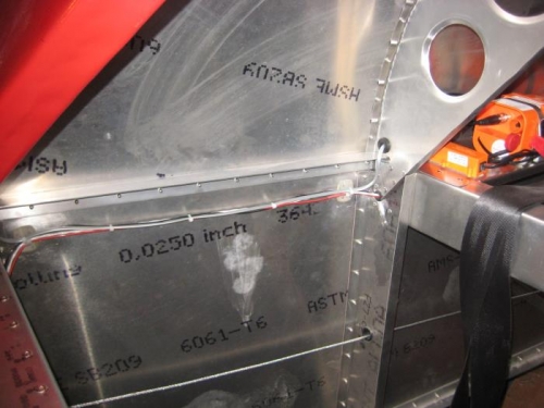 Gray telephone wire secured from ELT to ETL remote.