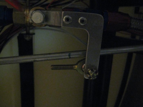 Mark tube for cutting. Rod end bearing seen above fuel valve arm.