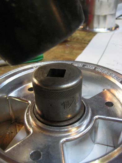 Socket on top of steel washer, on top of bearing race.