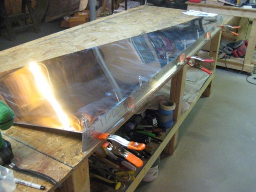 Clip angles have been riveted onto the channel, along with pilot holes into the channel.