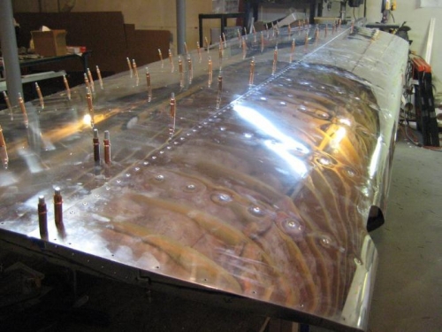 Length of spar + top surface of leading edge skin with all flush rivets installed.