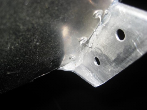 Removed material from lower flange of fuselage motor mount.