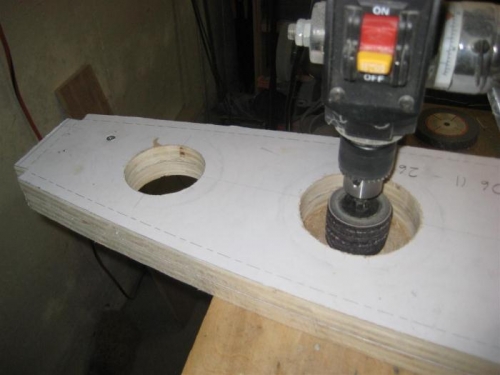 After cutting the holes with a jigsaw, used a rotary sanding drum to finish.