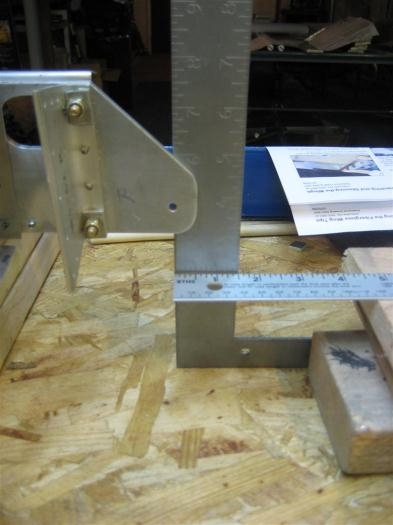 Carpenter's square to aligne the hole in the rear spar.