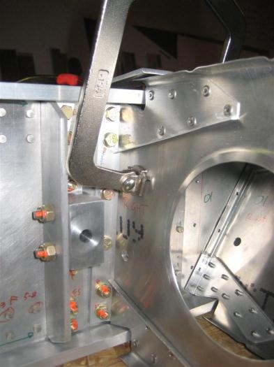 The root rib clamped in place. The piece of metal above the top of the rib is for alignment.