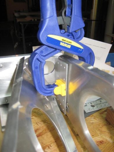 The rear of the root rib clamped to the angle bracket on the rear spar.