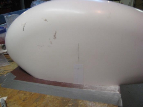 Using sandpaper to level the bottom openings.