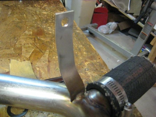 You have to drill a hole in the attachment, then bend it to fit.