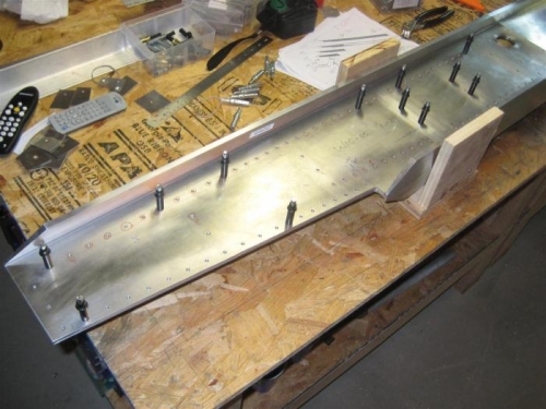 The jig holds the assembly at the exact spar spacing