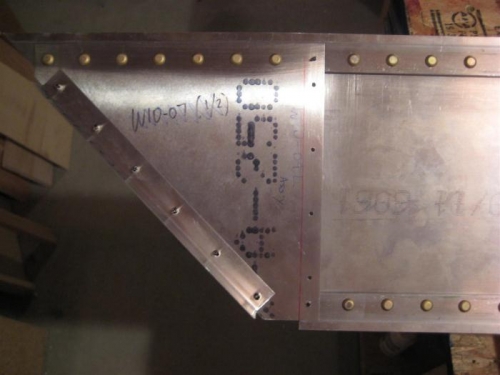 Wing tip web riveted