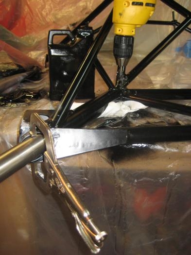 With the gear in the engine mount, I used the cobalt bit to start the hole in the gear leg.