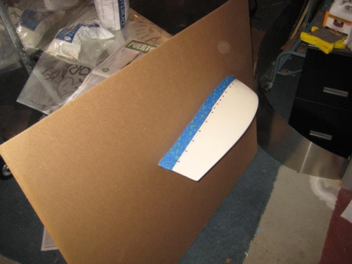 Right horizontal tail through cardboard.