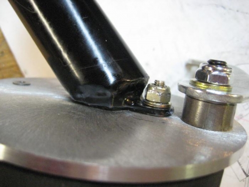 The right brake back plate and axle attach bolt.