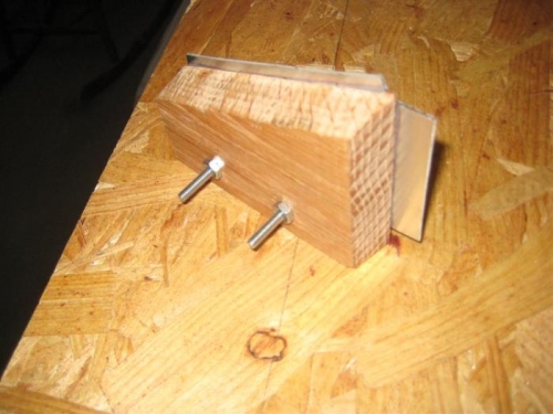 A bending block with gussett stock in place, and held with bolts.