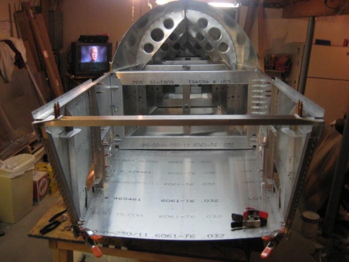 Bottom skin mostly in pace, and upper forward cross tie installed.