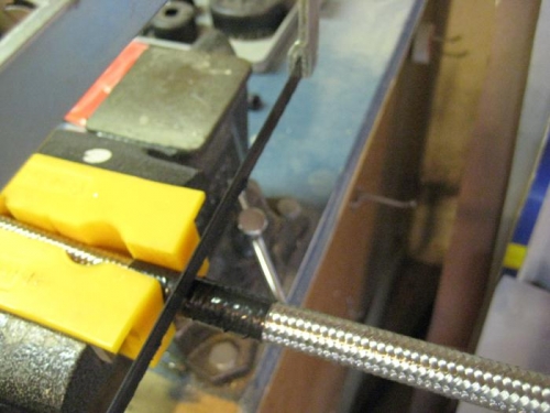 Making more braided hose. Duct tape and a hacksaw make smooth cuts.