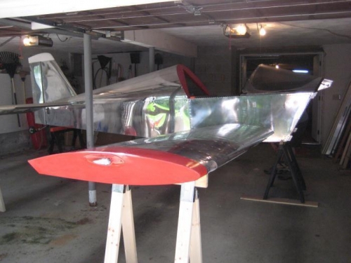 Wings inserted and supported on saw horses.