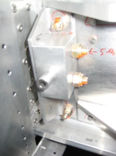 Drill guide inserted into left wing blocks, from rear to front.