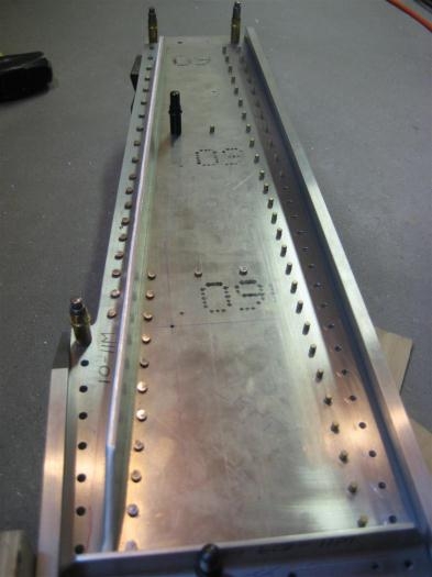 Set rivets on the left; yet to be squished rivets on the right.