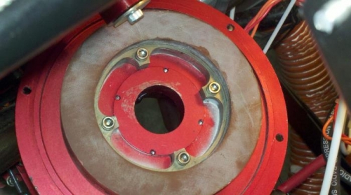 Brown is the stator ring, red is the alternator mount plate.