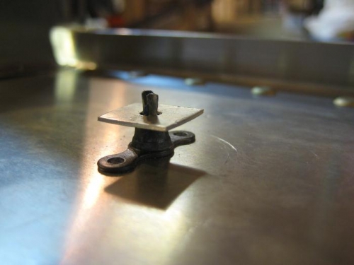 Anchor nut held in place with cleco (from below) and pc of alum w/ hole.