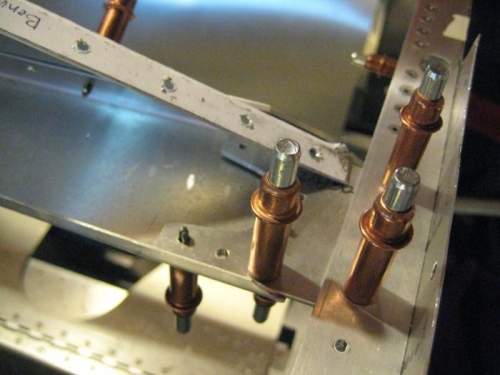 Cross tie plates drilled with glare shield removed